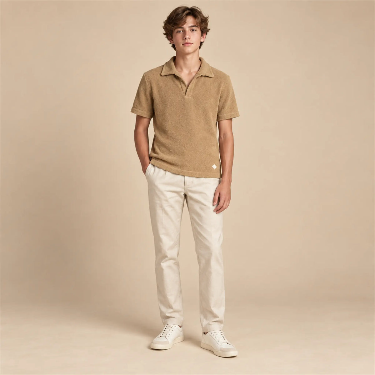Beige studio lookbook: Boy Terry Knitted Polo Shirt - Brown; 16Y; full-body child model; look 1