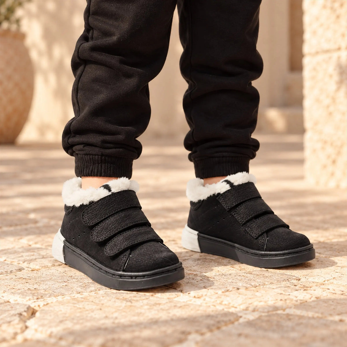 Three Strap Velcro Nubuk Leather Sneakers - Black close-up lookbook of a child wearing