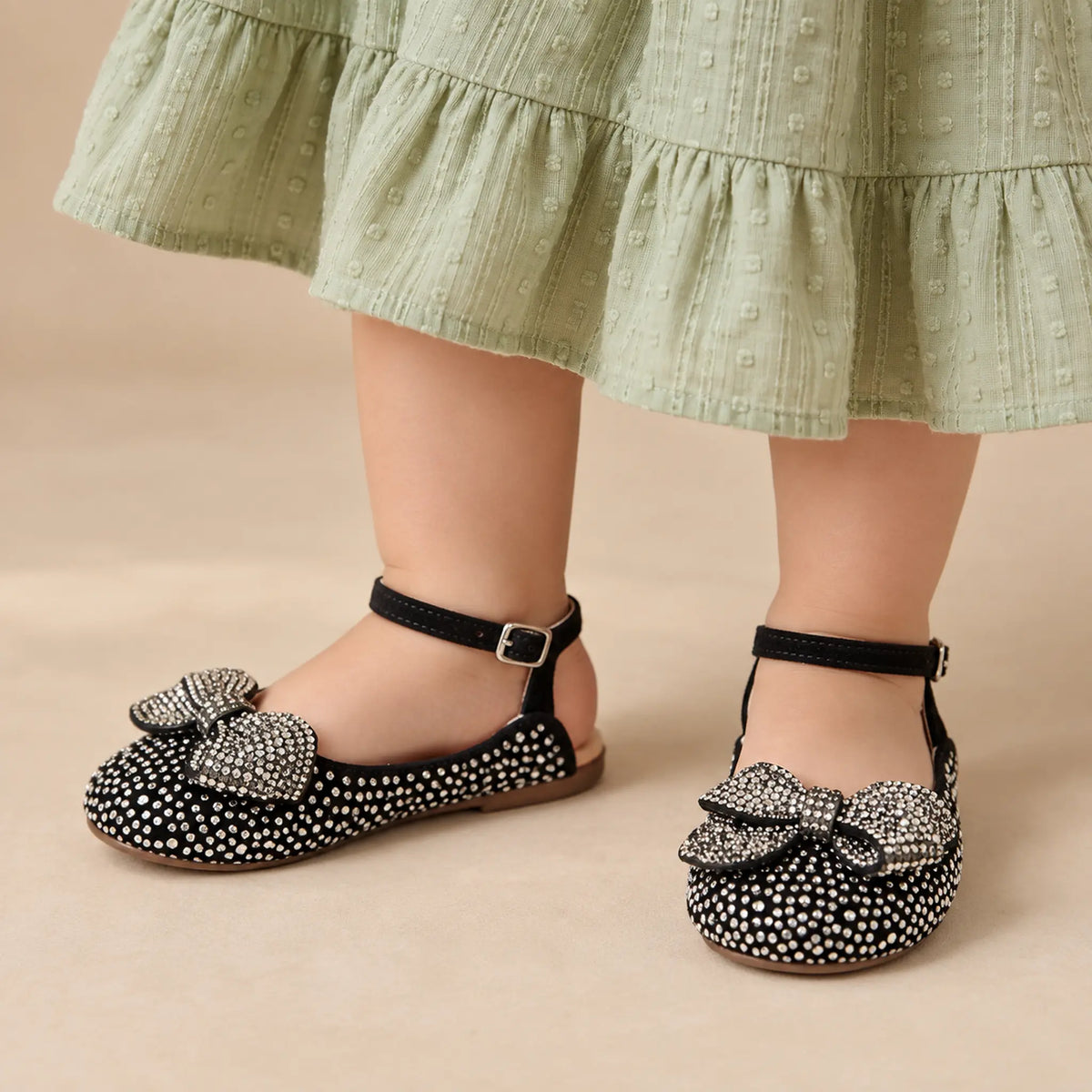 BabyWalker Black Rhinestone Bow Girls Sandals — worn shoe close-up