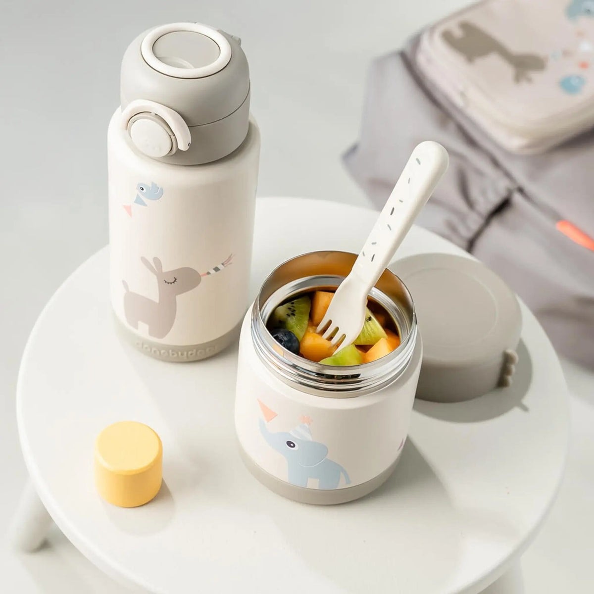 Lil Bunnies - The Collective insulated food jar in sand colour with cute animal print and matching fork on a table