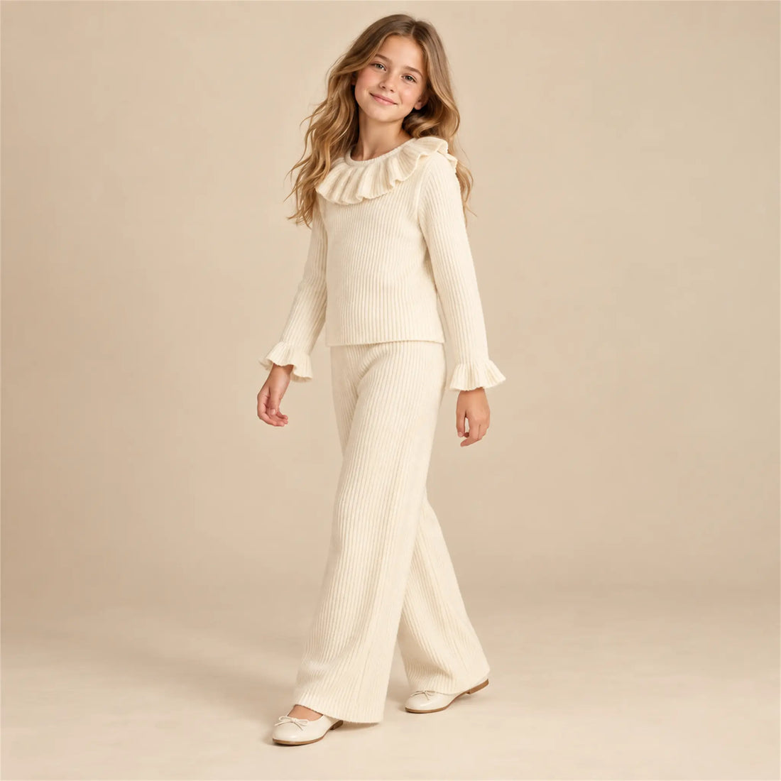 Beige studio lookbook: Ava Jumper &amp; Salia Pants; 12Y; full-body child model; look 1