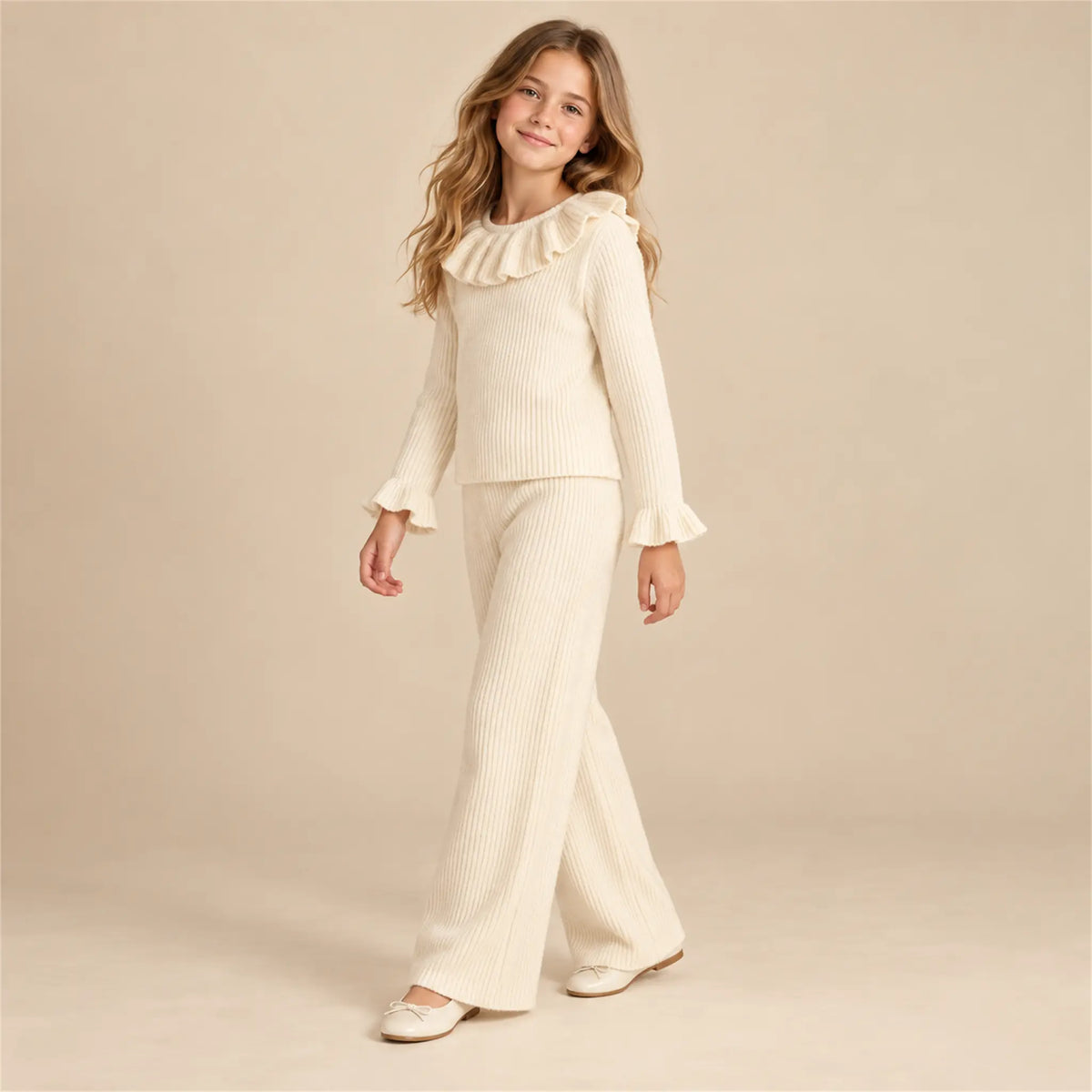 Beige studio lookbook: Ava Jumper &amp; Salia Pants; 12Y; full-body child model; look 1