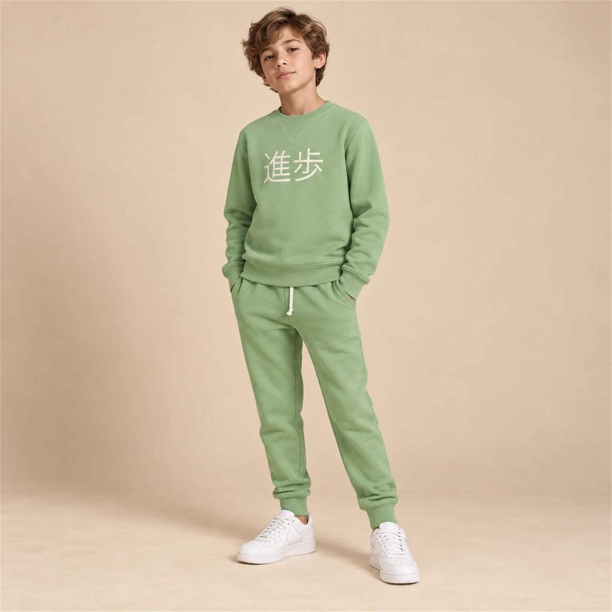 Beige studio lookbook: Crewneck Sweater &amp; Sweatpants; 11Y; full-body child model; look 1