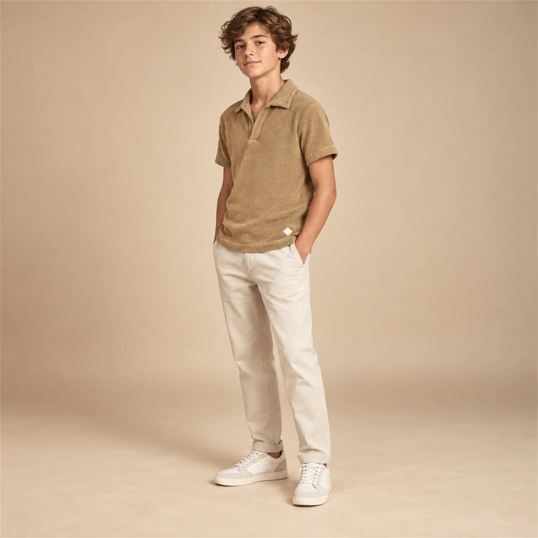 Beige studio lookbook: Boy Terry Knitted Polo Shirt - Brown; 14Y; full-body child model; look 1