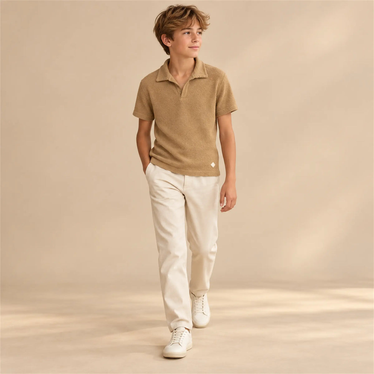 Beige studio lookbook: Boy Terry Knitted Polo Shirt - Brown; 14Y; full-body child model; look 2