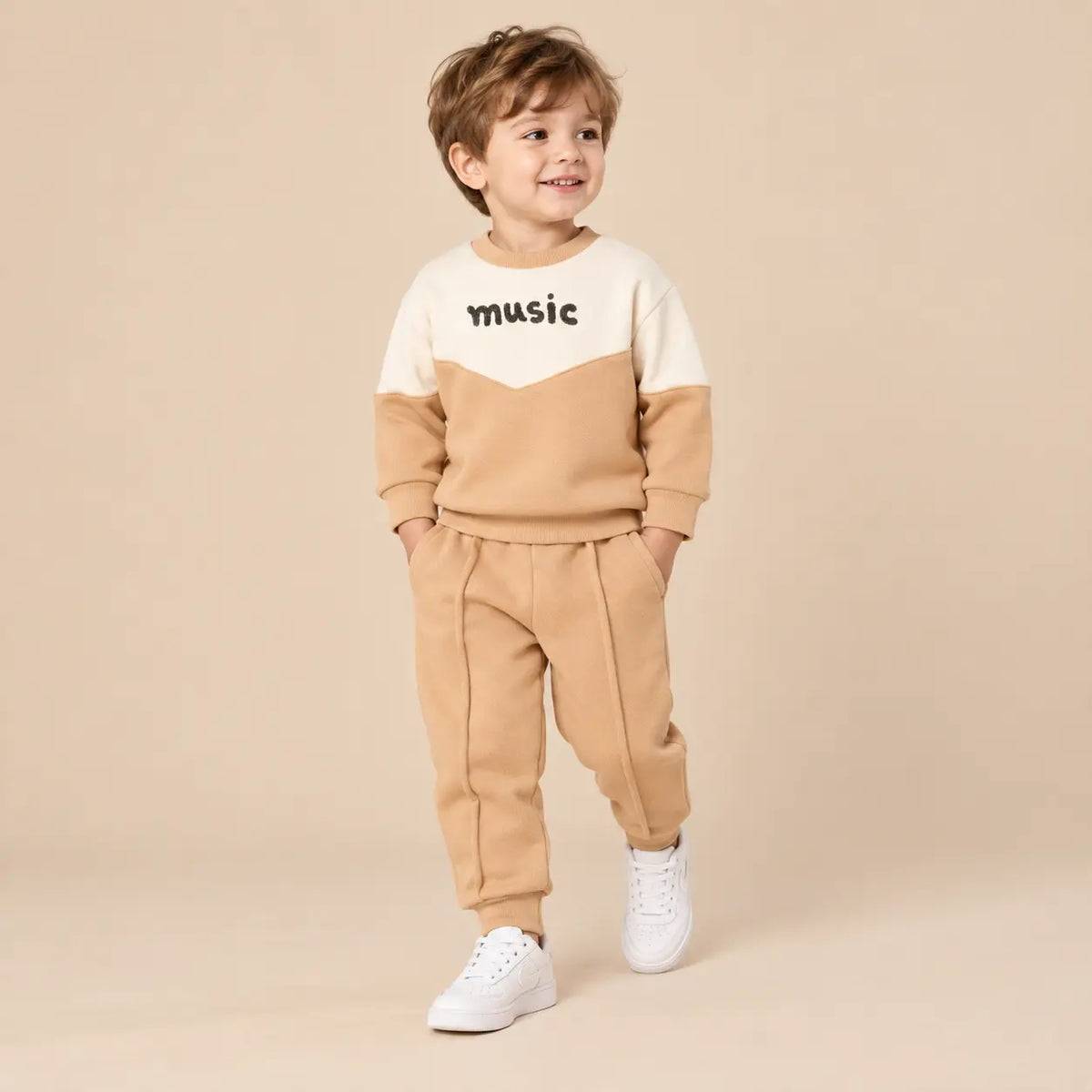 3 year boy wearing Beige &amp; White Organic Cotton Sweatshirt &amp; Sweatpants second pose