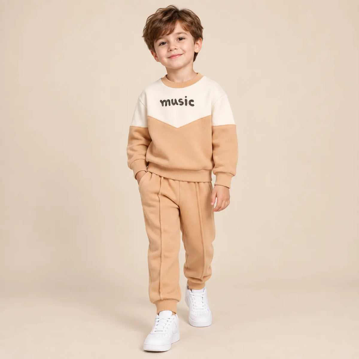 5 year boy wearing Beige &amp; White Organic Cotton Sweatshirt &amp; Sweatpants second pose