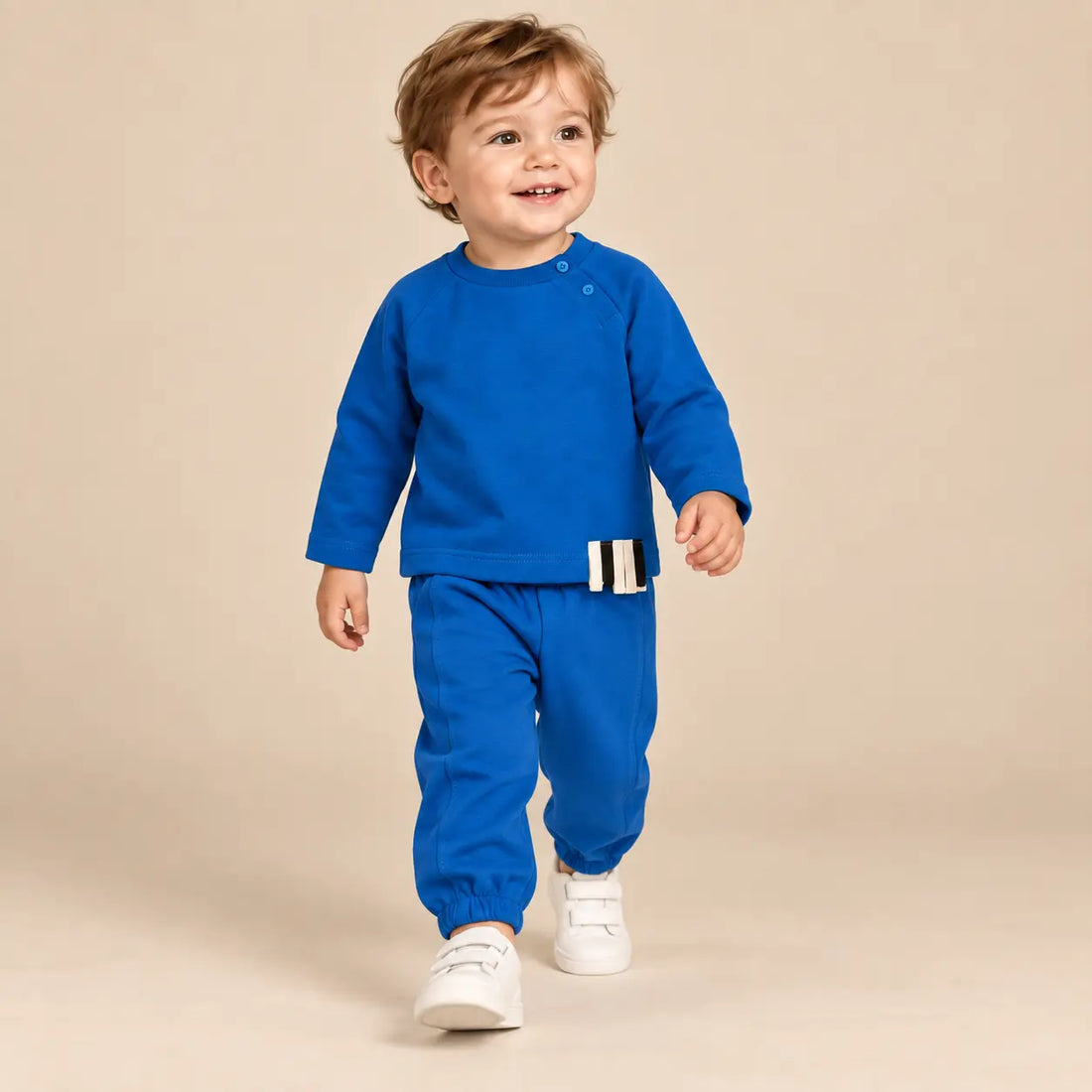 18 month boy wearing Blue Organic Cotton Sweatshirt &amp; Sweatpants walking pose