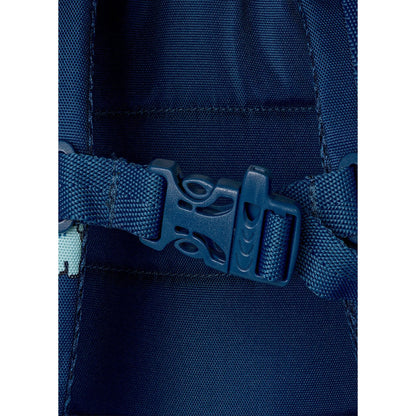 Close-up of the blue plastic chest strap buckle on a Lil Bunnies - The Collective medium dinosaur backpack