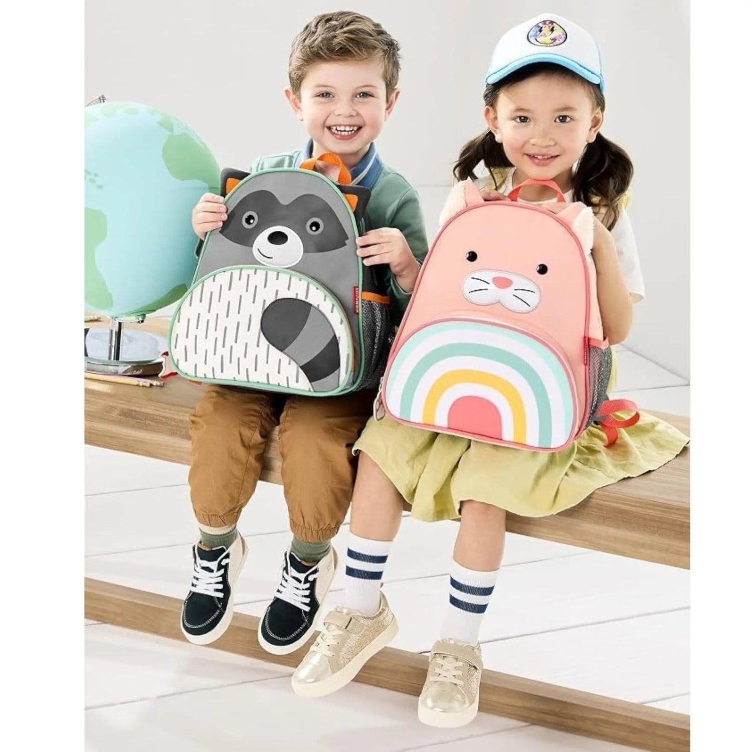 Lil Bunnies - The Collective cat and raccoon zoo backpacks for children, featuring cute animal faces and rainbow design