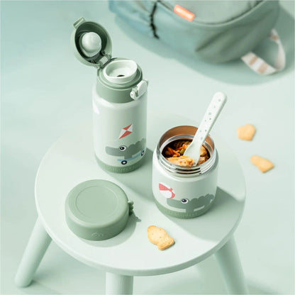 Lil Bunnies - The Collective green insulated food jar and matching water bottle with cute crocodile print on a stool