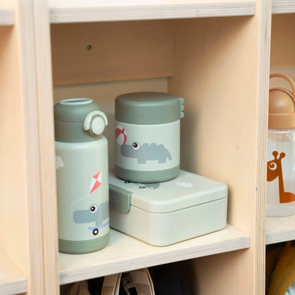 Lil Bunnies - The Collective green insulated food jar with crocodile print on a wooden shelf next to a matching bottle