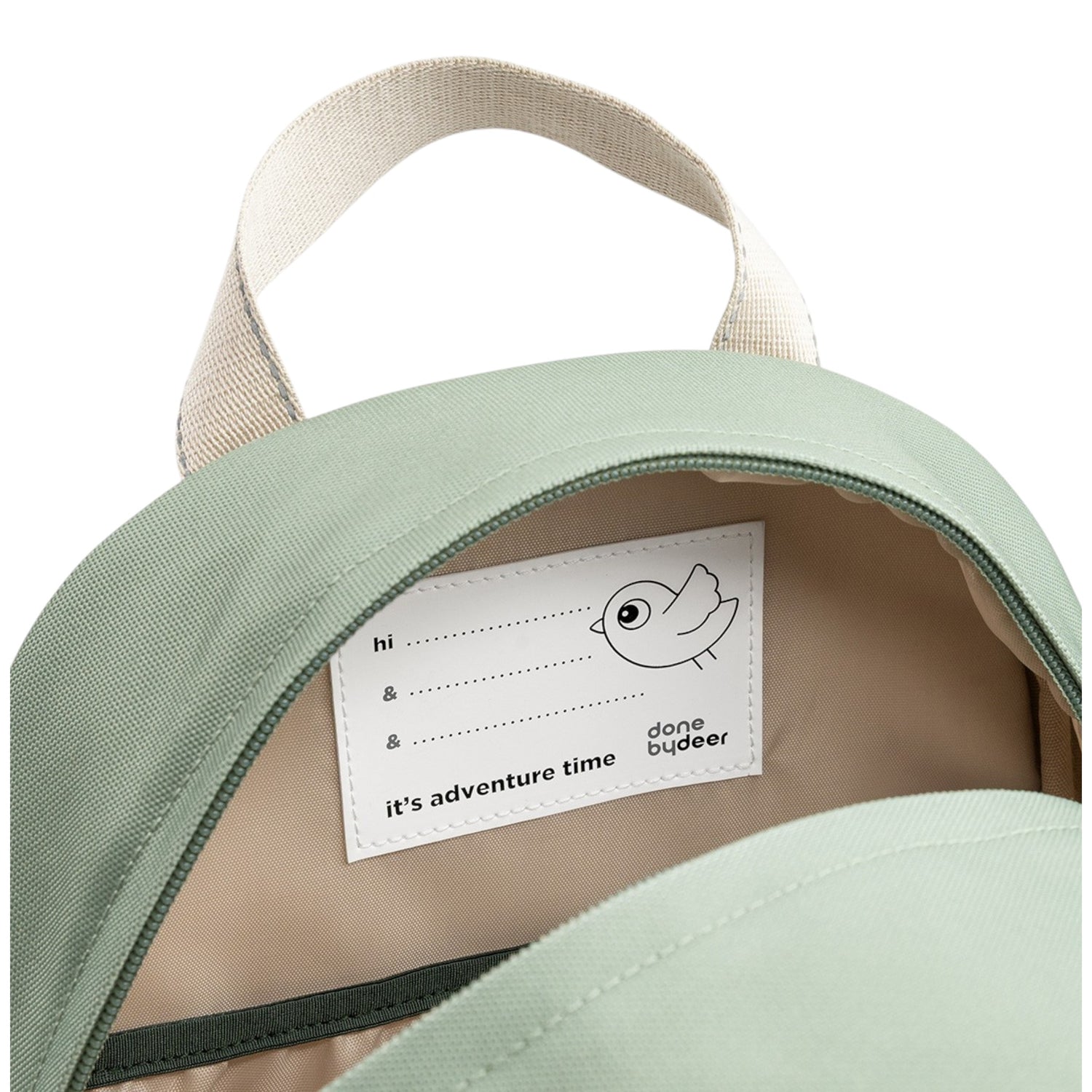Lil Bunnies - The Collective Junior Backpack in green with a name tag label inside the open main compartment