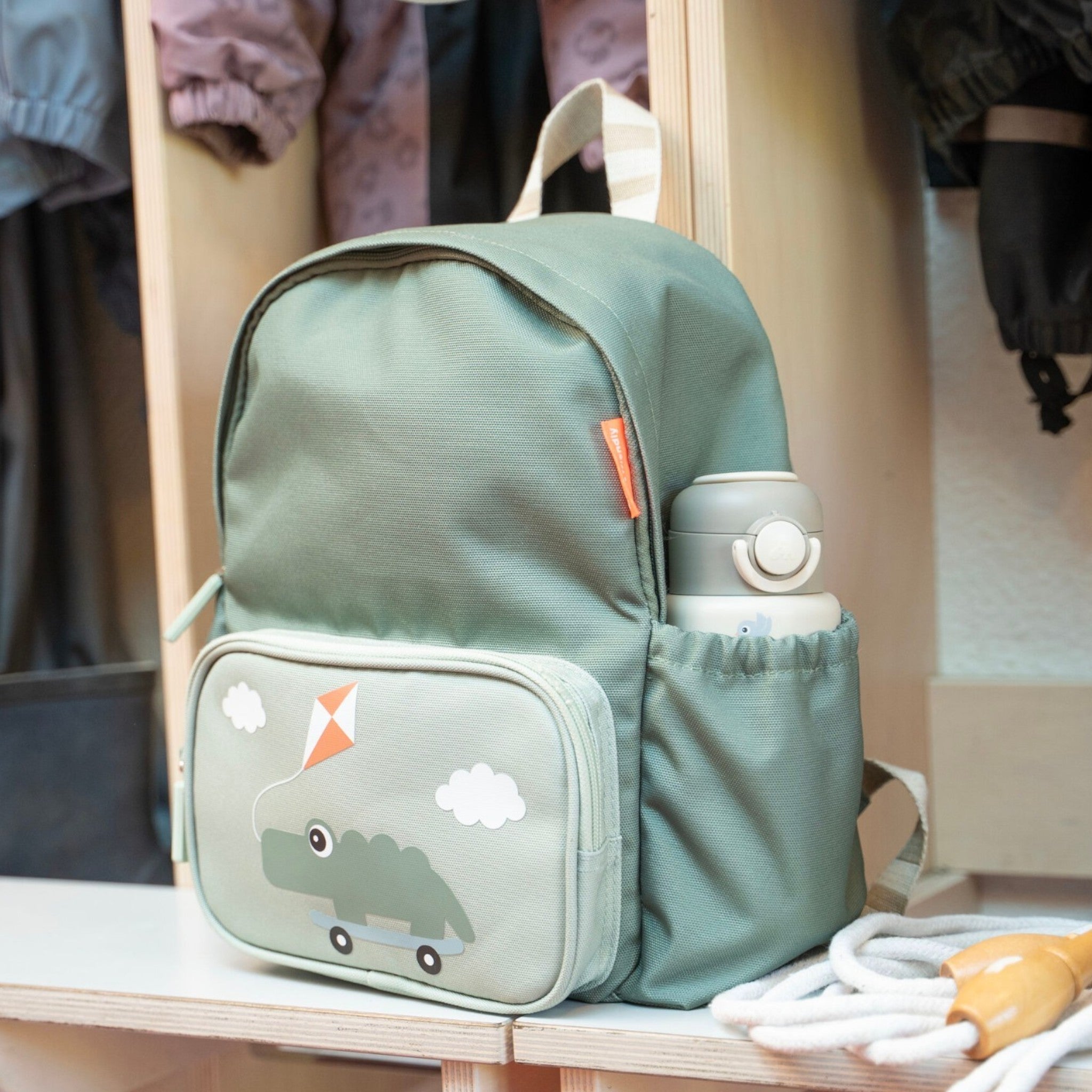 Lil Bunnies - The Collective sage green kids backpack with a crocodile graphic and a matching insulated water bottle.