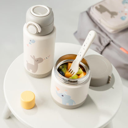 Lil Bunnies - The Collective insulated food jar in sand colour with cute animal print and matching fork on a table