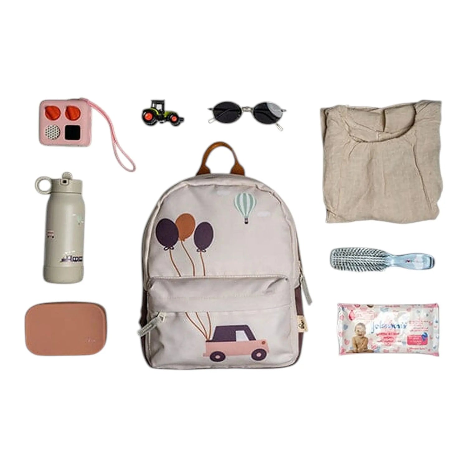 Lil Bunnies - The Collective mini backpack with vehicle and balloon print surrounded by kids travel accessories