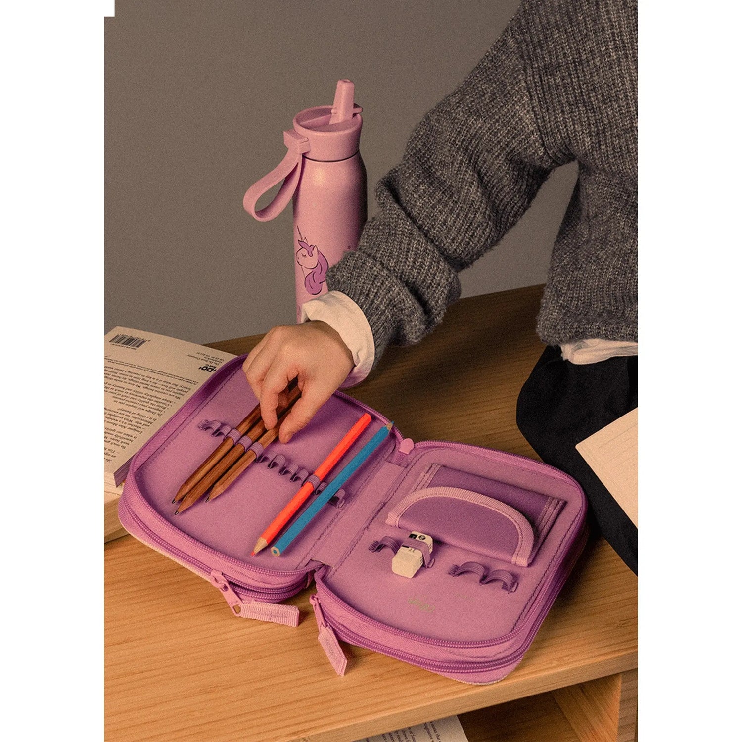 Lil Bunnies - The Collective layered pencil case in dusty pink with unicorn print, open with stationery inside