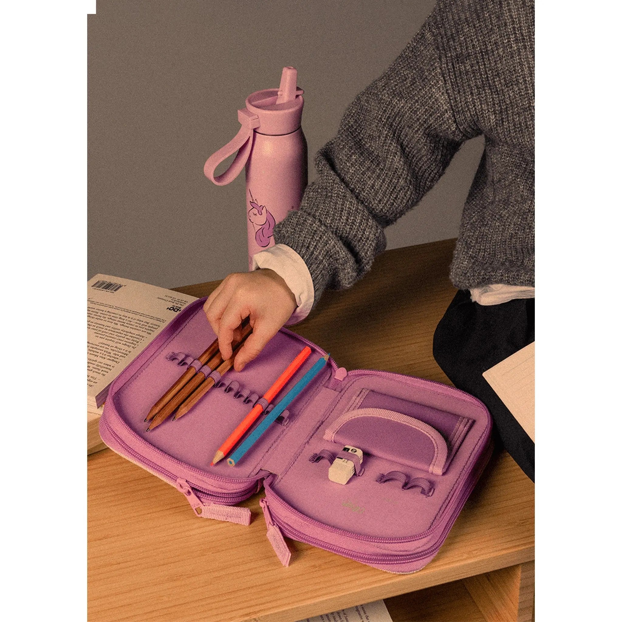 Lil Bunnies - The Collective layered pencil case in dusty pink with unicorn print, open with stationery inside