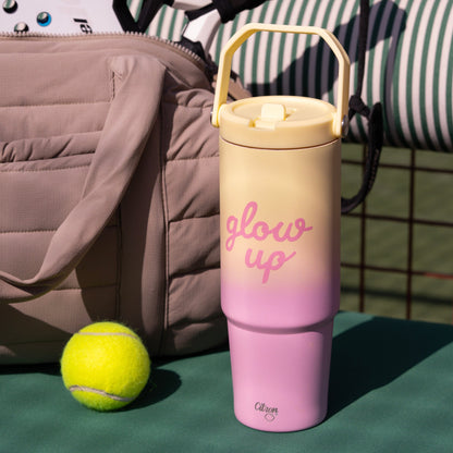 Lil Bunnies - The Collective 900ml insulated tumbler in pink and yellow ombre with glow up text on a tennis court