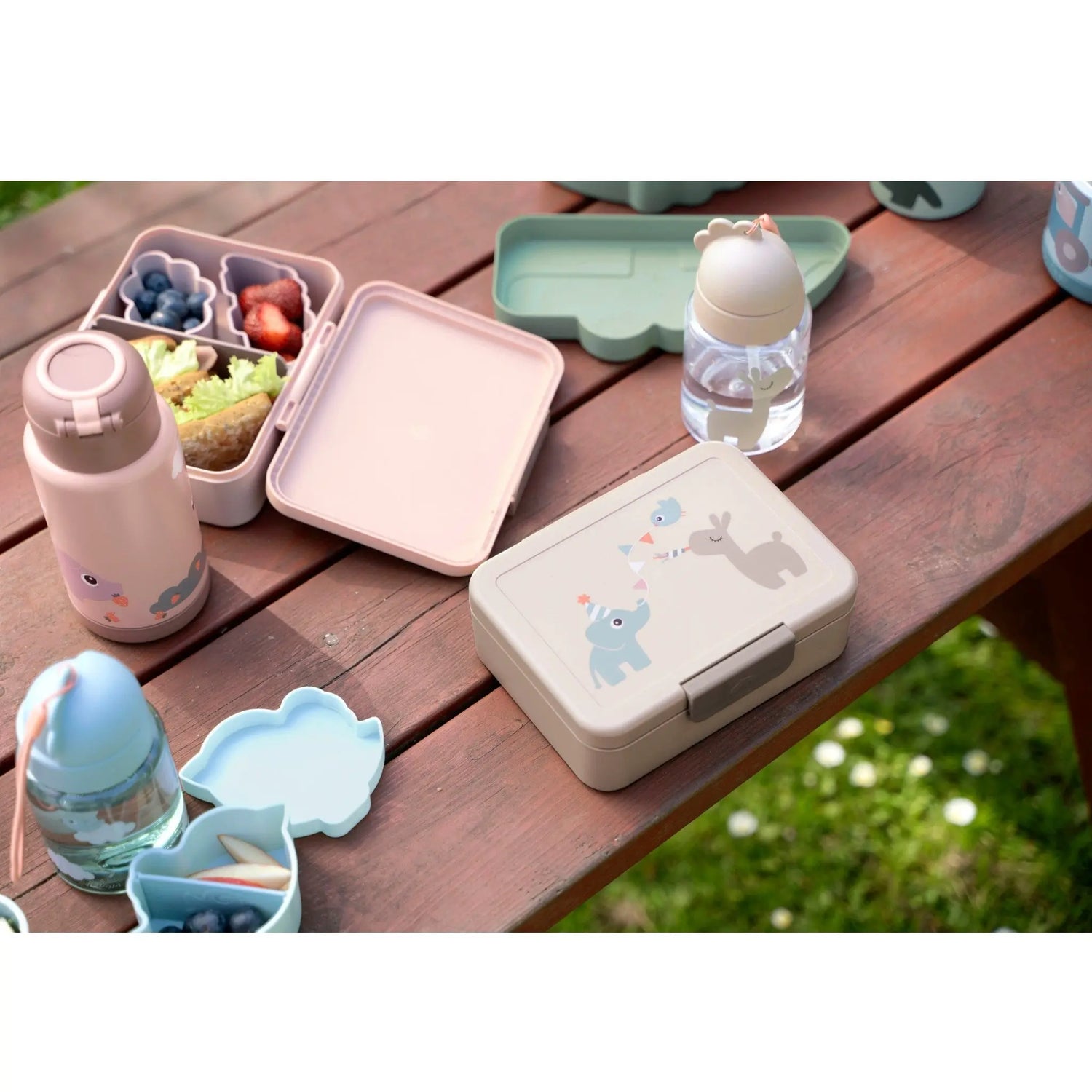 Lil Bunnies - The Collective sand-coloured lunch box with divider featuring cute animal illustrations on a wooden table