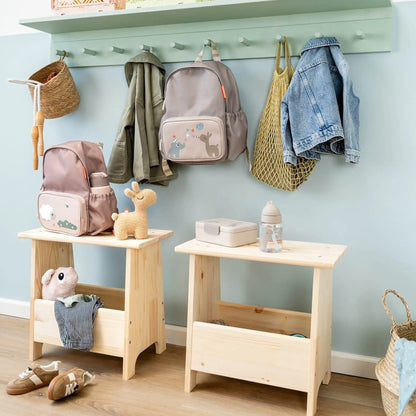 Lil Bunnies - The Collective sand-colored lunch box with divider sitting on a wooden stool in a nursery setting