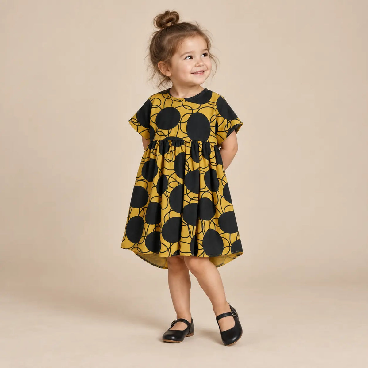 2 year girl wearing Silvia Retro Flowers Yellow Dress second pose