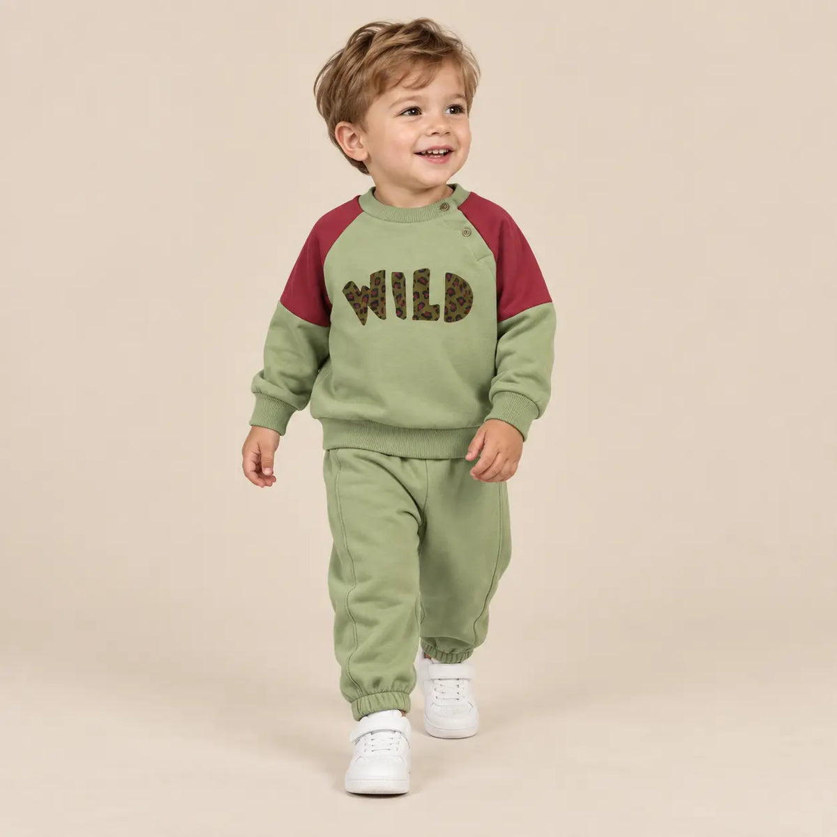 2 year boy wearing Wild Pistachio Organic Cotton Sweatshirt &amp; Sweatpants second pose