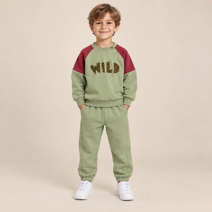 5 year boy wearing Wild Pistachio Organic Cotton Sweatshirt &amp; Sweatpants