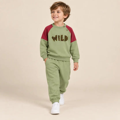 5 year boy wearing Wild Pistachio Organic Cotton Sweatshirt &amp; Sweatpants second pose