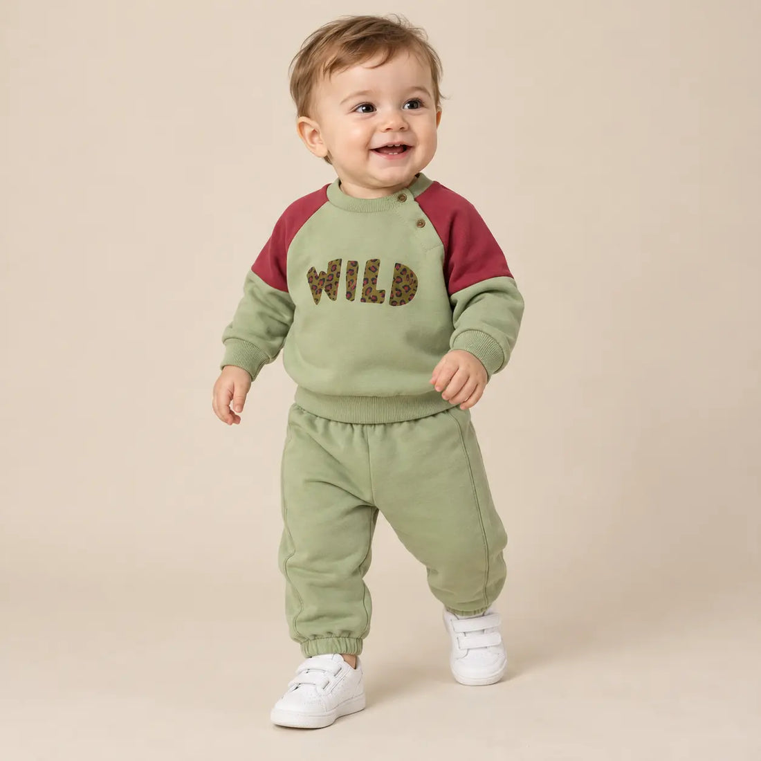 9 month boy wearing Wild Pistachio Organic Cotton Sweatshirt &amp; Sweatpants second pose