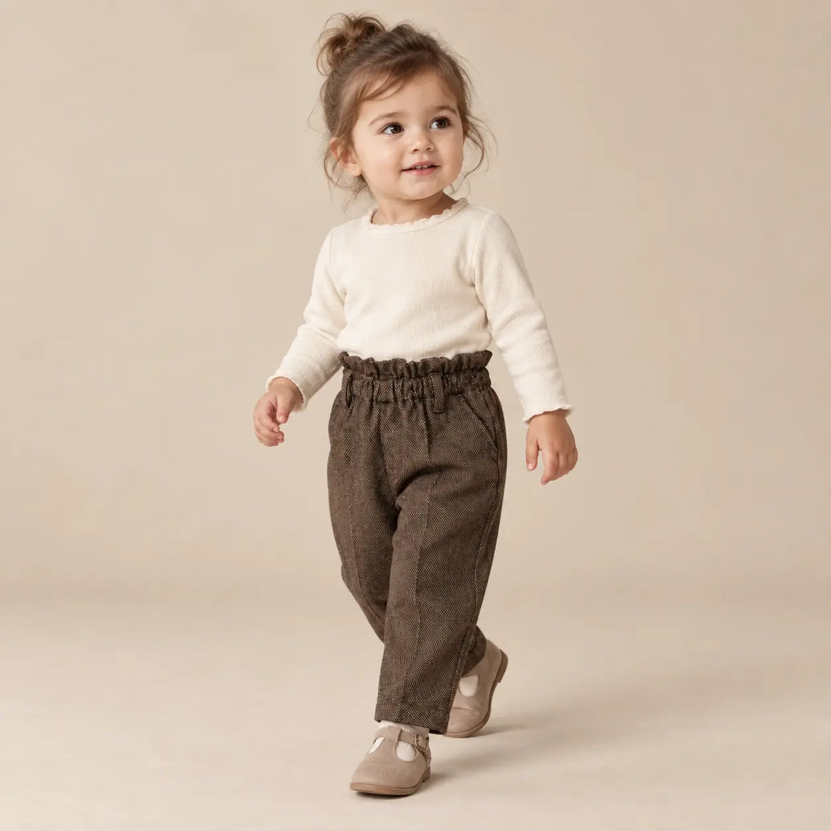 18 month girl wearing Woven Pants walking pose